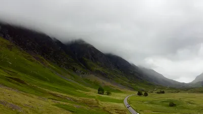 The Glen Coe valley road beneath a cloud-covered ridgeline