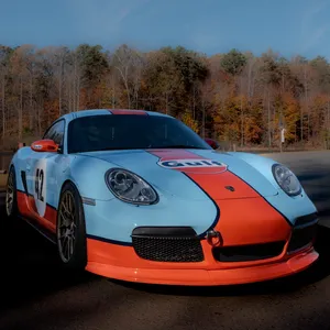 A Porsche Cayman in Gulf livery with the number 42
